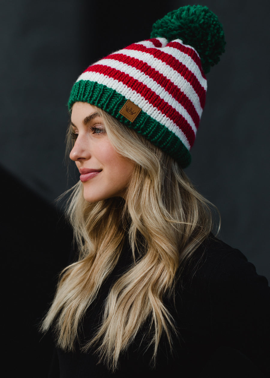 green pom and red hat