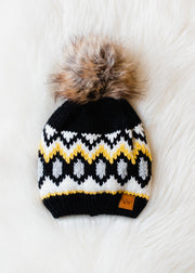 yellow white and grey hat with pom