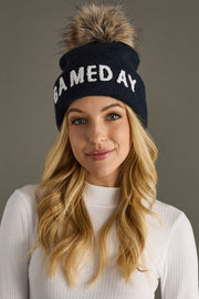 Front view of Panache Apparel’s navy and white Game Day pom hat.
