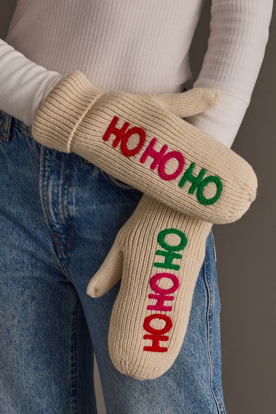 Beige Ho Ho Ho Mittens featuring embroidered text in alternating red, pink, and green letters.