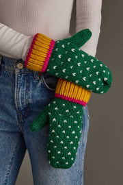 A person wearing blue jeans and a white ribbed shirt has on Panache Apparel Collection’s Green, White & Mustard Heart Design Mittens.
