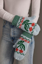 A person wearing Panache Apparel Collection’s Light Blue Cherry Pattern Mittens, paired with a white ribbed top and light blue jeans.
