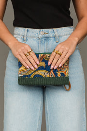 Front view of Panache Apparel Collection’s green multicolored wristlet featuring a vibrant paisley-inspired pattern and zipper closure.