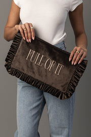 A person in a white top and jeans holds the Panache Apparel Collection Full Of It Ruffle Travel Pouch, featuring “FULL OF IT” embroidered on the front.