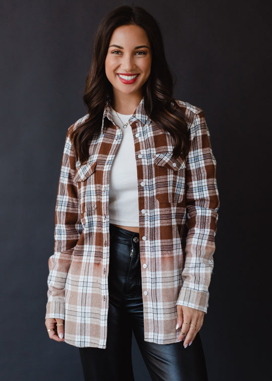 brown, black, blue and white plaid flannel