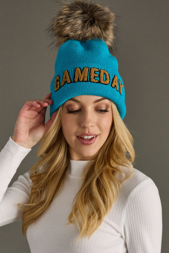 bright blue and tan game day pom hat, game day hat,  Honolulu blue, bright blue pom hat, winter hat, women's pom hat