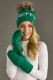 Woman wearing a green knit hat and gloves with 'Merry' text on a gray background