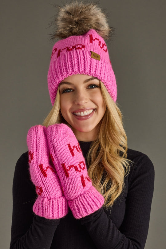 Woman wearing a pink knit hat and mittens with text on a gray background