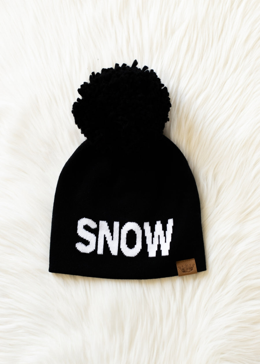 Black beanie with 'SNOW' text on a white textured background
