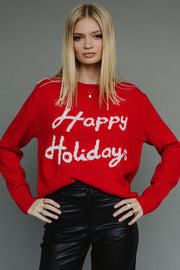 Person wearing a red sweater with 'Happy Holidays' text against a gray background