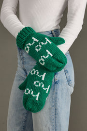 A person wearing a white shirt and Panache Apparel Collection's Ho Ho Ho Mittens in green & white.