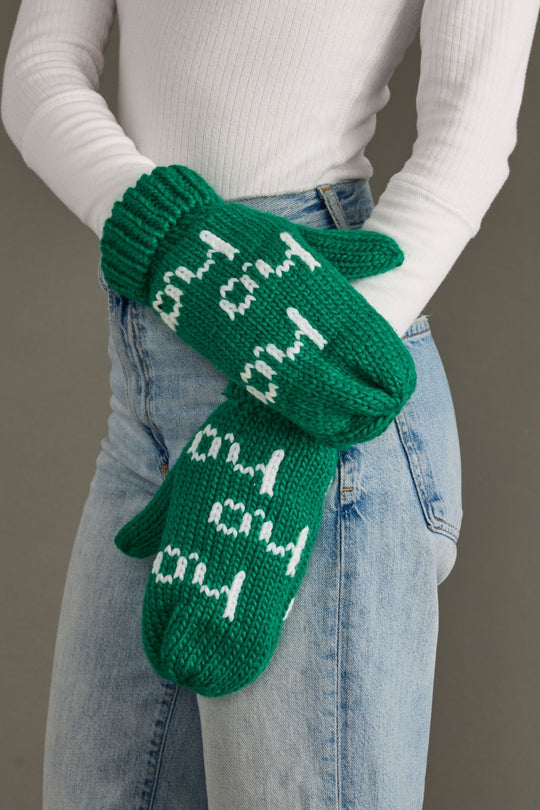 A person wearing a white shirt and Panache Apparel Collection's Ho Ho Ho Mittens in green & white.