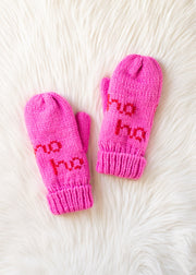 Pair of pink mittens with 'ho ho ho' text on a white fur background