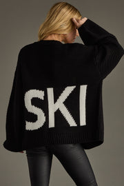 black knit ski cardigan, ski cardigan, black cardigan, women's cardigan, ski trip, ski vacation, neutral cardigan