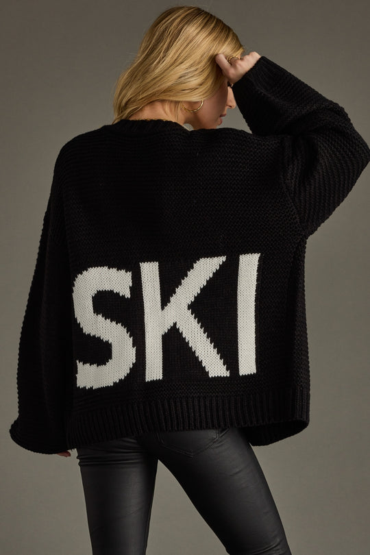 black knit ski cardigan, ski cardigan, black cardigan, women's cardigan, ski trip, ski vacation, neutral cardigan