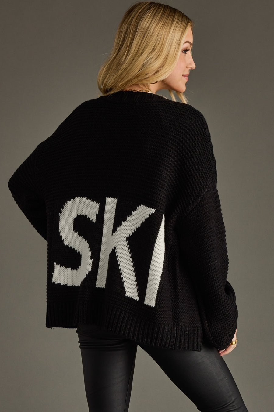 black knit ski cardigan, ski cardigan, black cardigan, women's cardigan, ski trip, ski vacation, neutral cardigan