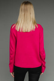 Person wearing a bright pink sweater against a gray background
