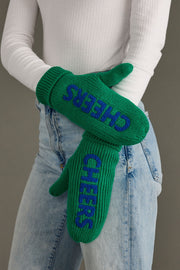Green gloves with 'CHEERS' text worn by a person in light blue jeans against a neutral background
