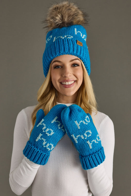 Woman wearing a blue knit hat and mittens with text on a gray background